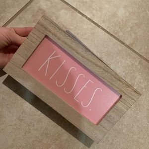 Rae Dunn kisses sign